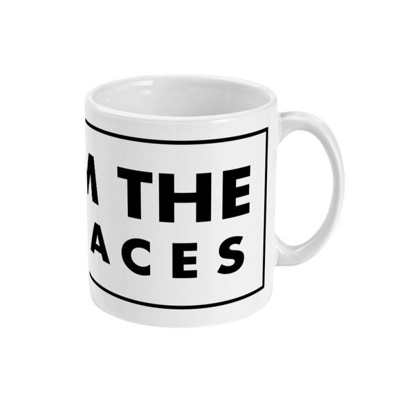 A white ceramic mug with black text that reads 'FROM THE TERRACES'.