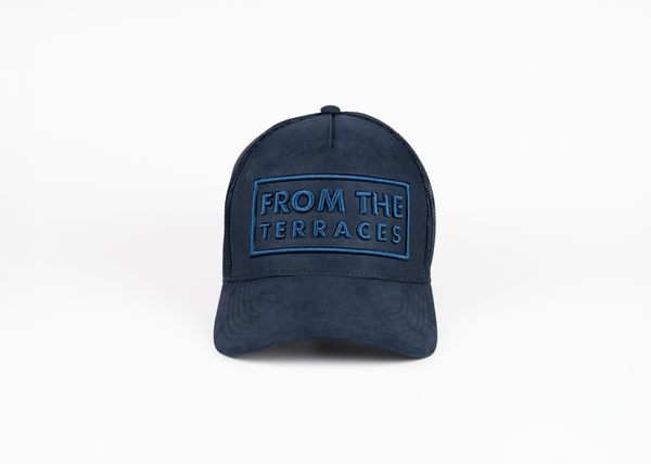 Navy blue cap with 'From the Terraces' text on a white background