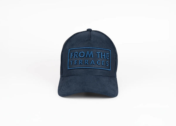 Navy blue cap with 'From the Terraces' text on a white background