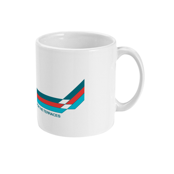 An 11oz ceramic mug with a glossy white finish, featuring geometric patterns and the 'FTT' logo with text 'FROM THE TERRACES' on it.