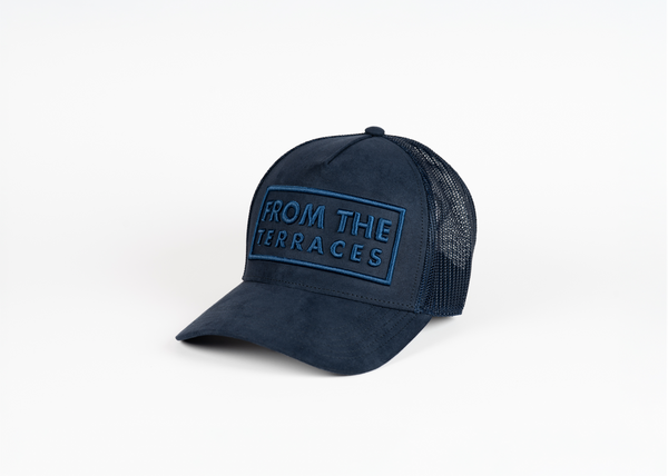 Navy blue cap with 'From the Terraces' text on a white background