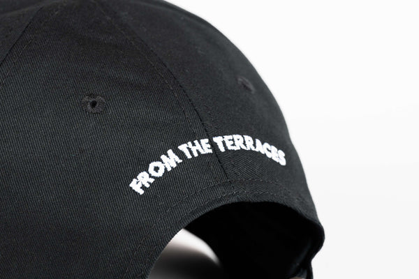 Black cap with 'FROM THE TERRACES' text on a white background