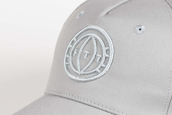 Gray cap with a white logo on a light gray background
