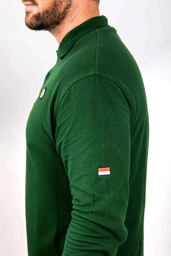 Green long-sleeve shirt with brand logos on a white background