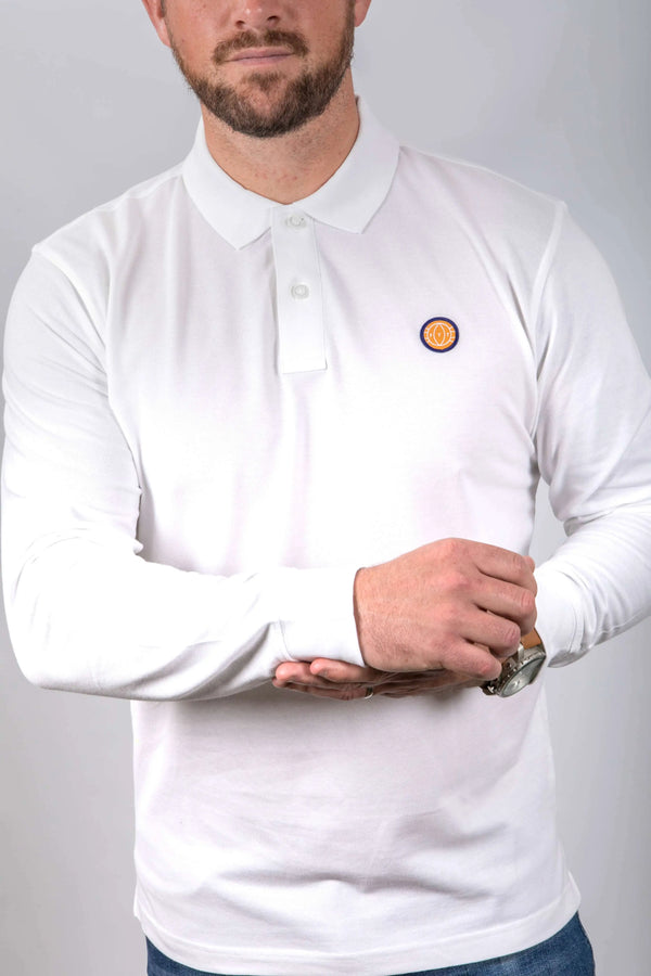 Person wearing a white long-sleeve polo shirt with a small logo on a plain background