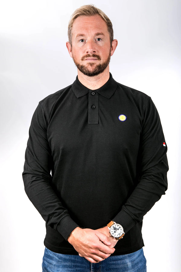 Man wearing a black long-sleeve polo shirt with a logo on a white background