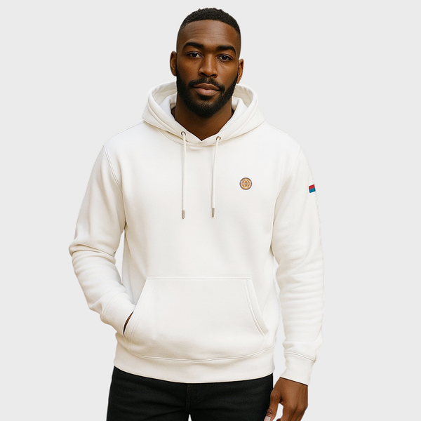 Man wearing a white hoodie with brand logos on a light gray background