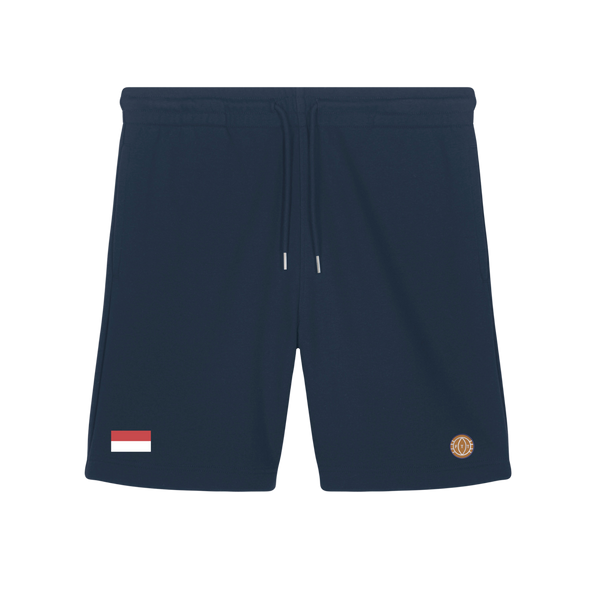 Navy blue shorts with a small flag patch and logo on a white background