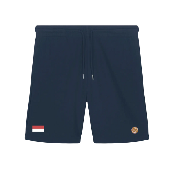 Navy blue shorts with a small flag patch and logo on a white background