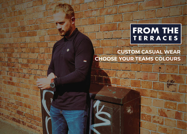 Man leaning against a brick wall with promotional text for 'From the Terraces' custom casual wear.
